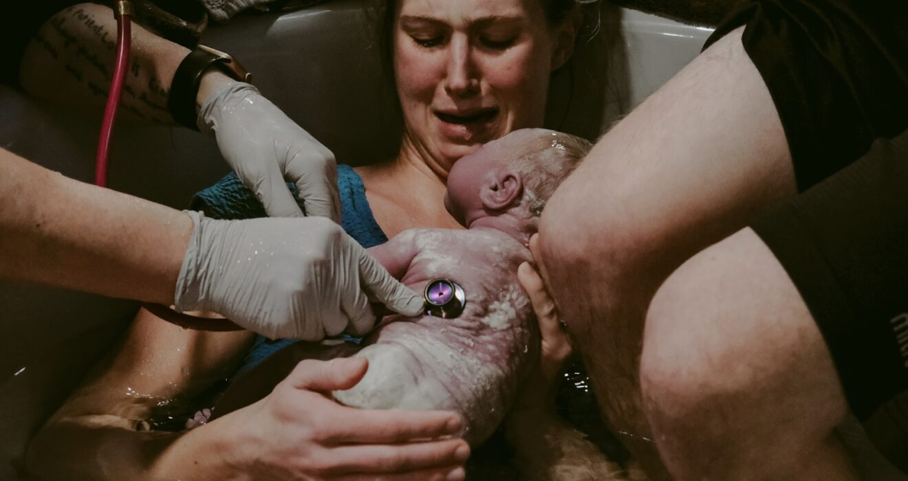 a person holding a baby
